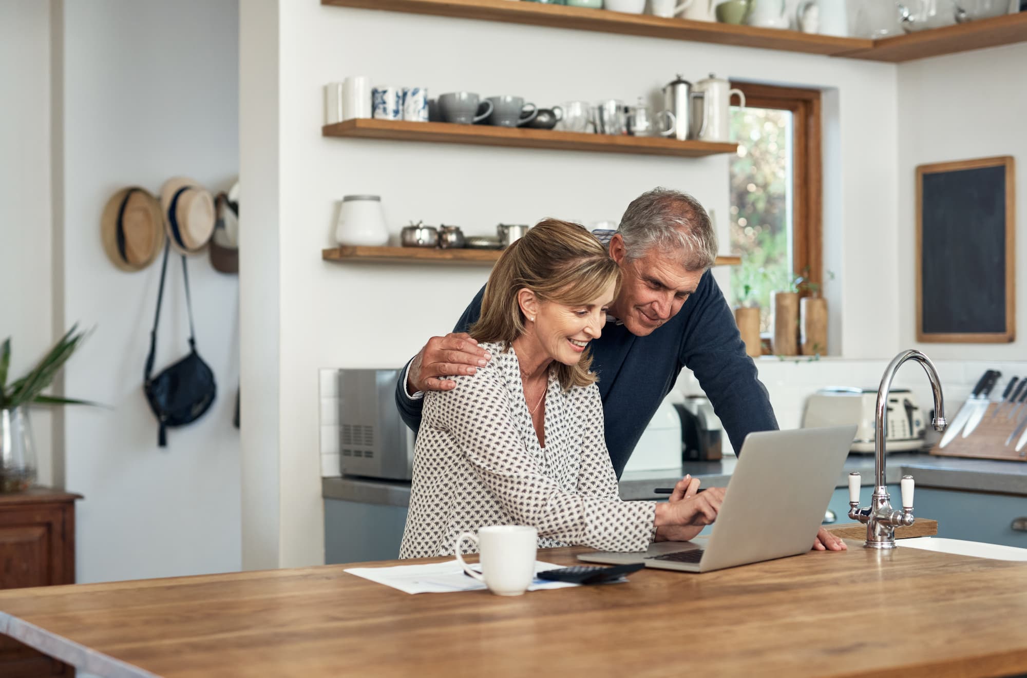 Senior couple looking at laptop